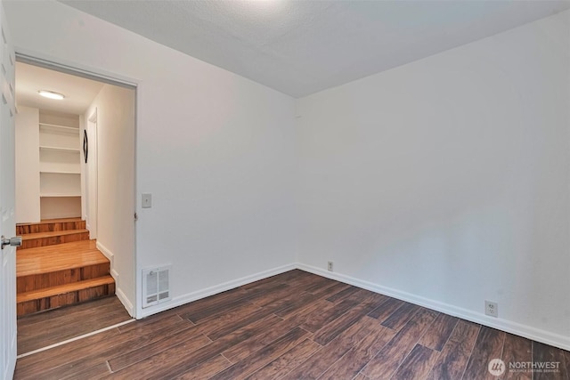 11427 Military Rd, Seattle, WA 98168 - unfurnished room with dark wood finished floors and baseboards