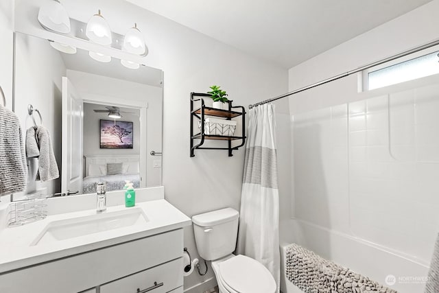 full bathroom with toilet, vanity, and shower / tub combo with curtain