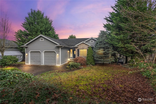 ranch-style house featuring a garage