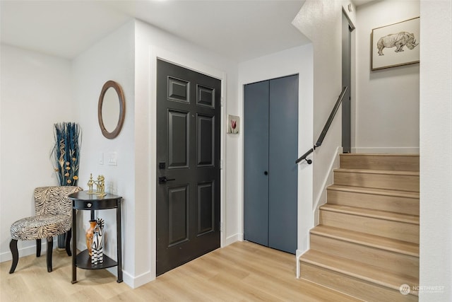 foyer entrance with hardwood / wood-style floors