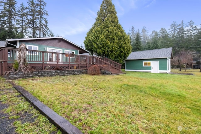 view of yard featuring an outdoor structure and a wooden deck