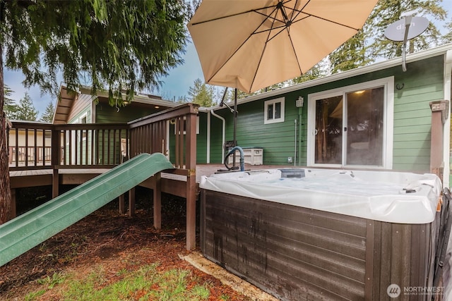 exterior space with a hot tub