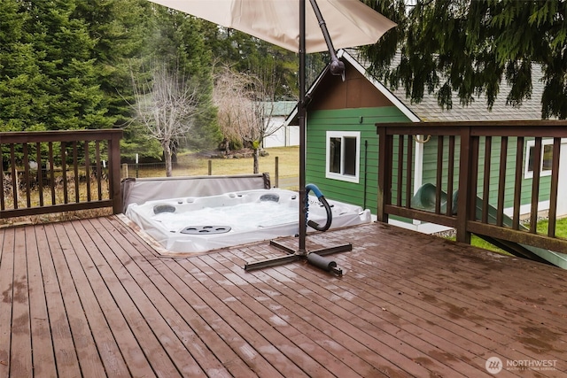 wooden deck featuring a hot tub