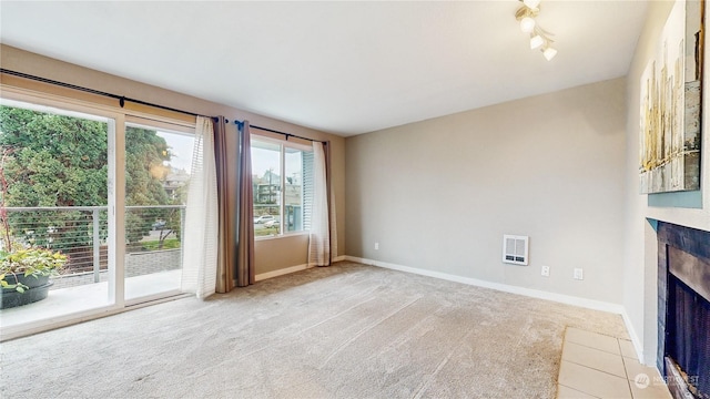 unfurnished living room featuring light colored carpet