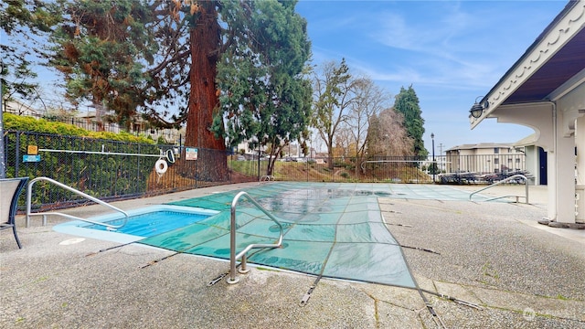 view of swimming pool with a patio area