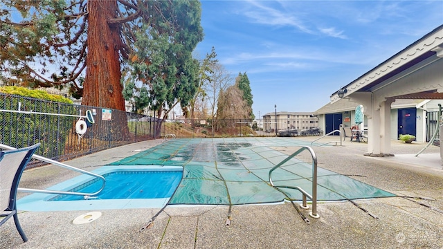 view of swimming pool featuring a patio area