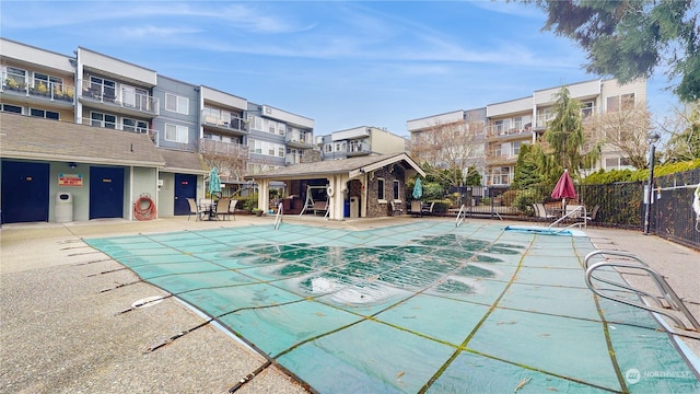 view of swimming pool with a patio