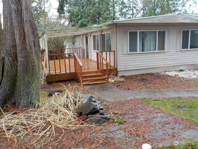 exterior space featuring a wooden deck