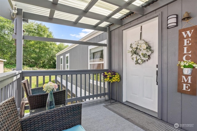 doorway to property featuring a porch