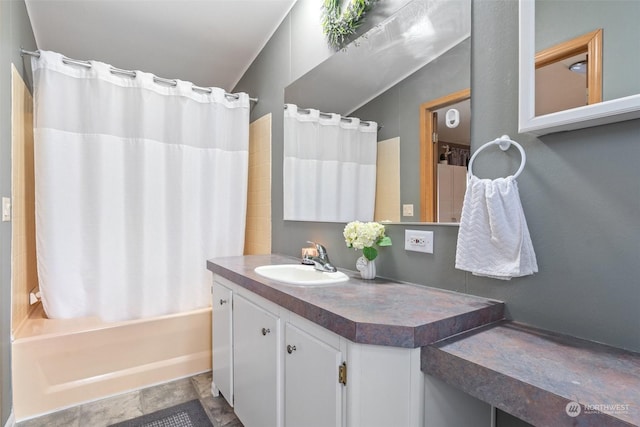 bathroom with shower / tub combo and vanity