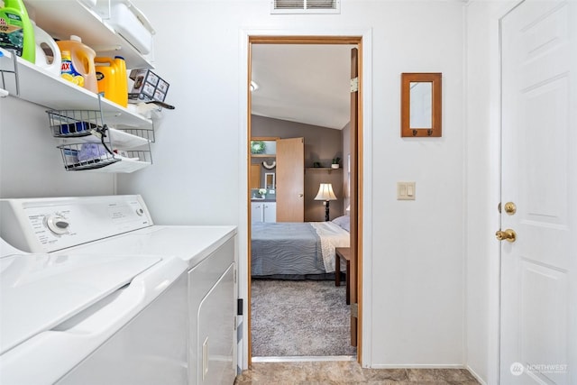 washroom with light carpet and washer and clothes dryer