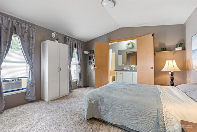 carpeted bedroom with multiple windows and vaulted ceiling