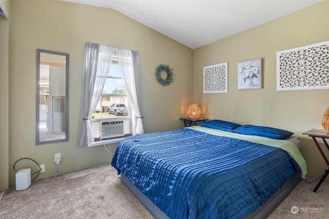 carpeted bedroom featuring lofted ceiling