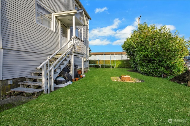 view of yard featuring a trampoline