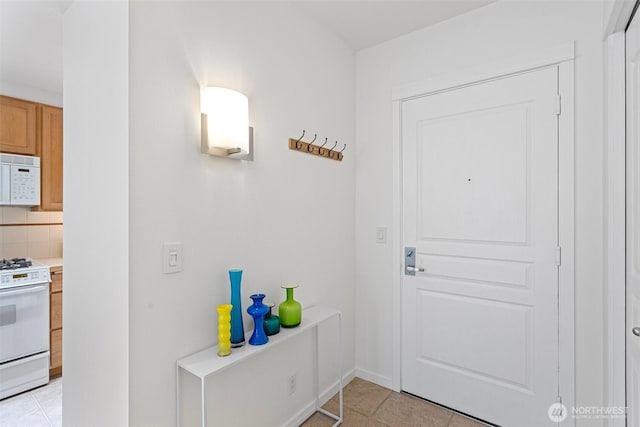 entryway featuring light tile patterned floors