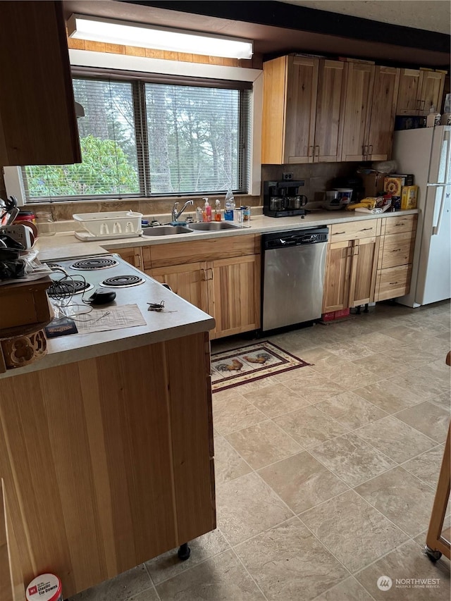 4757 State Route 109, Moclips, WA 98562 - kitchen with dishwasher, freestanding refrigerator, light countertops, tasteful backsplash, and light stone finish floors