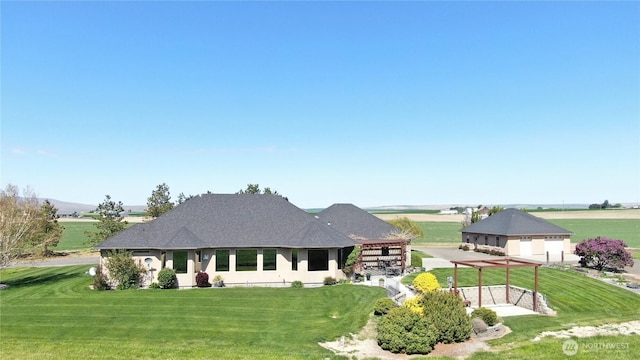 1078 Gardena Creek Rd, Touchet, WA 99360 - rear view of property featuring a lawn, a garage, and a pergola