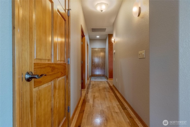 1078 Gardena Creek Rd, Touchet, WA 99360 - hall with light wood-style floors, baseboards, and a textured wall