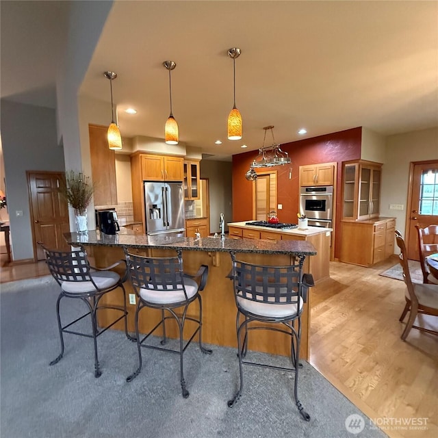 1078 Gardena Creek Rd, Touchet, WA 99360 - kitchen featuring stainless steel refrigerator with ice dispenser, gas stovetop, light wood-type flooring, a peninsula, and glass insert cabinets