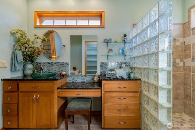 1078 Gardena Creek Rd, Touchet, WA 99360 - kitchen with a sink, brown cabinetry, dark stone counters, backsplash, and open shelves