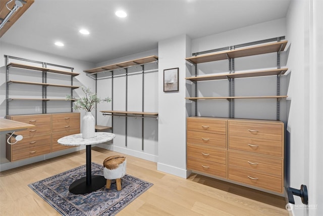 walk in closet featuring light wood-type flooring