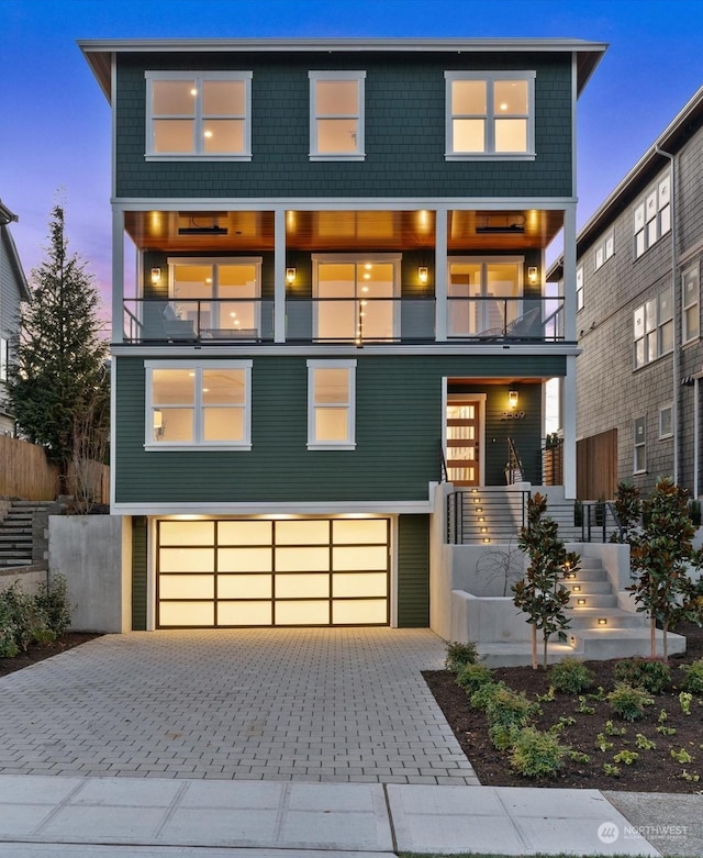 contemporary house with a balcony and a garage