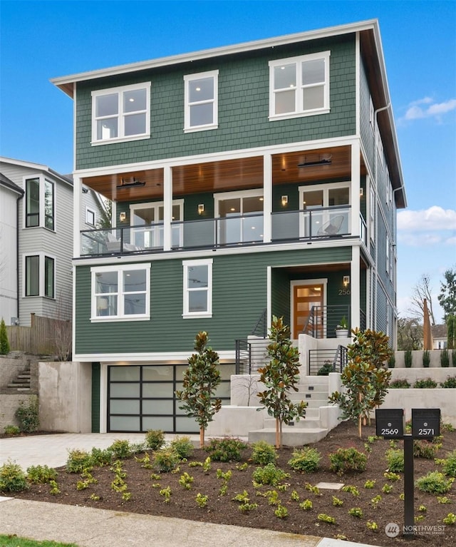 view of front of house with a balcony and a garage