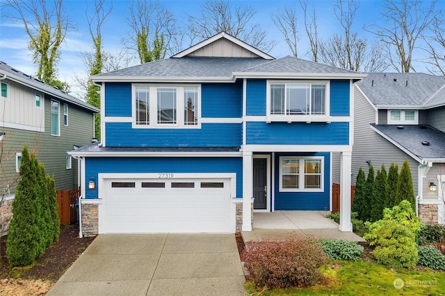 view of front of property with a garage