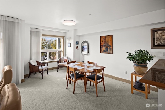 view of carpeted dining area