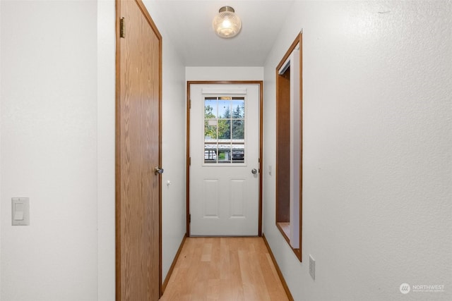 doorway with light hardwood / wood-style flooring