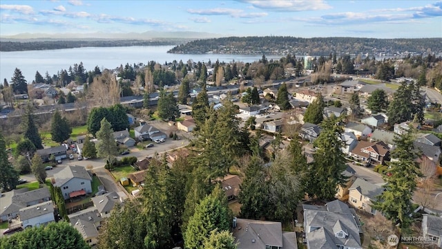 bird's eye view featuring a residential view and a water view