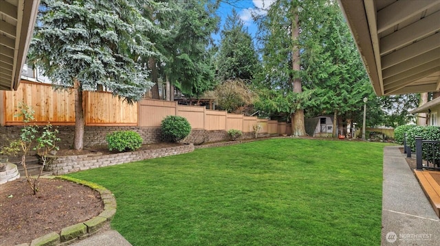 view of yard with a fenced backyard