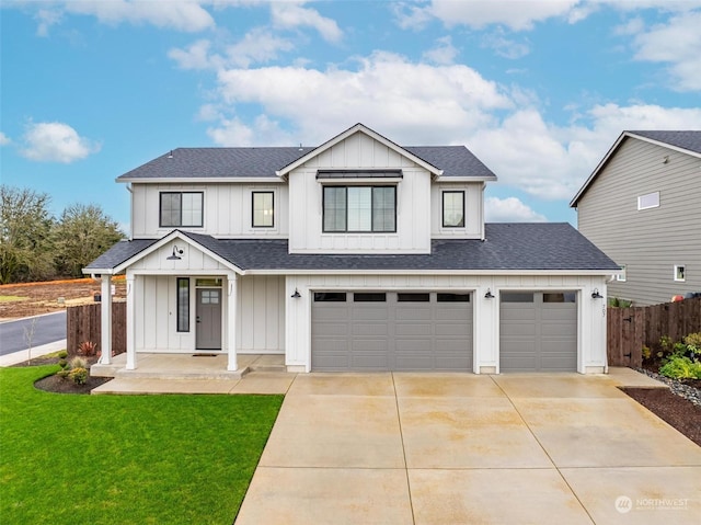 modern farmhouse style home with covered porch, a front yard, and a garage