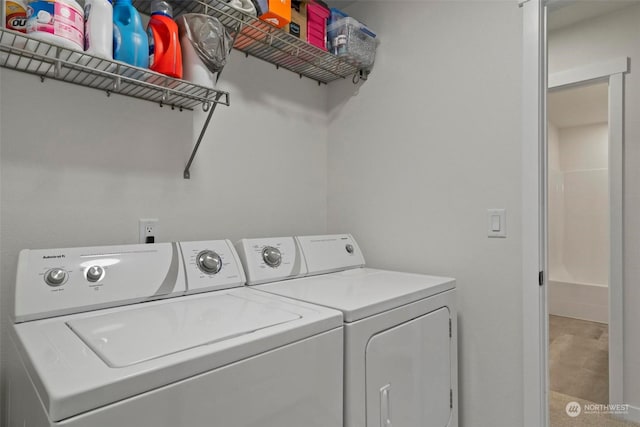 washroom with washer and dryer