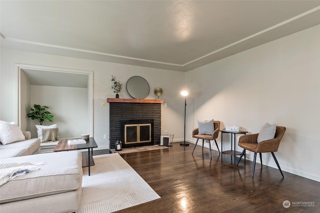 living room featuring dark hardwood / wood-style floors and a fireplace