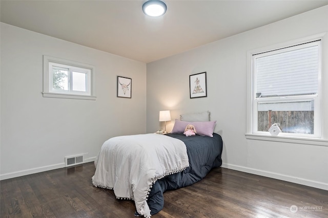 bedroom featuring dark hardwood / wood-style floors