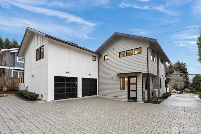 view of front of house with decorative driveway and a garage