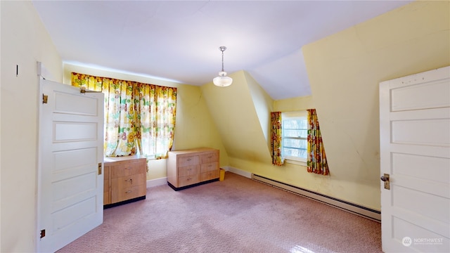 unfurnished bedroom with baseboard heating and light carpet