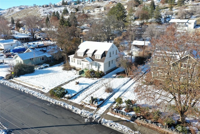 snowy aerial view with a mountain view