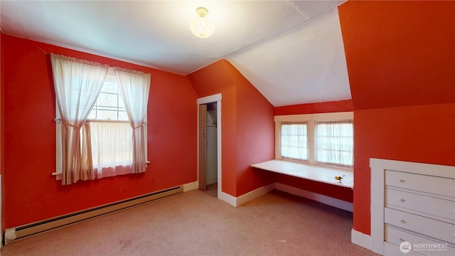 bonus room featuring baseboards, carpet flooring, vaulted ceiling, and baseboard heating