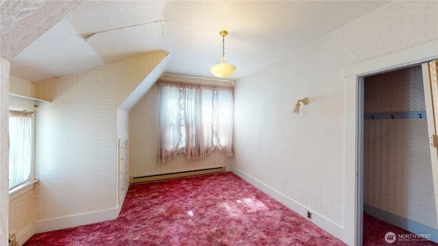 additional living space featuring baseboards, carpet flooring, and baseboard heating