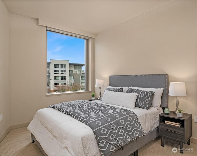 bedroom with light carpet