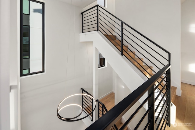 staircase featuring wood-type flooring