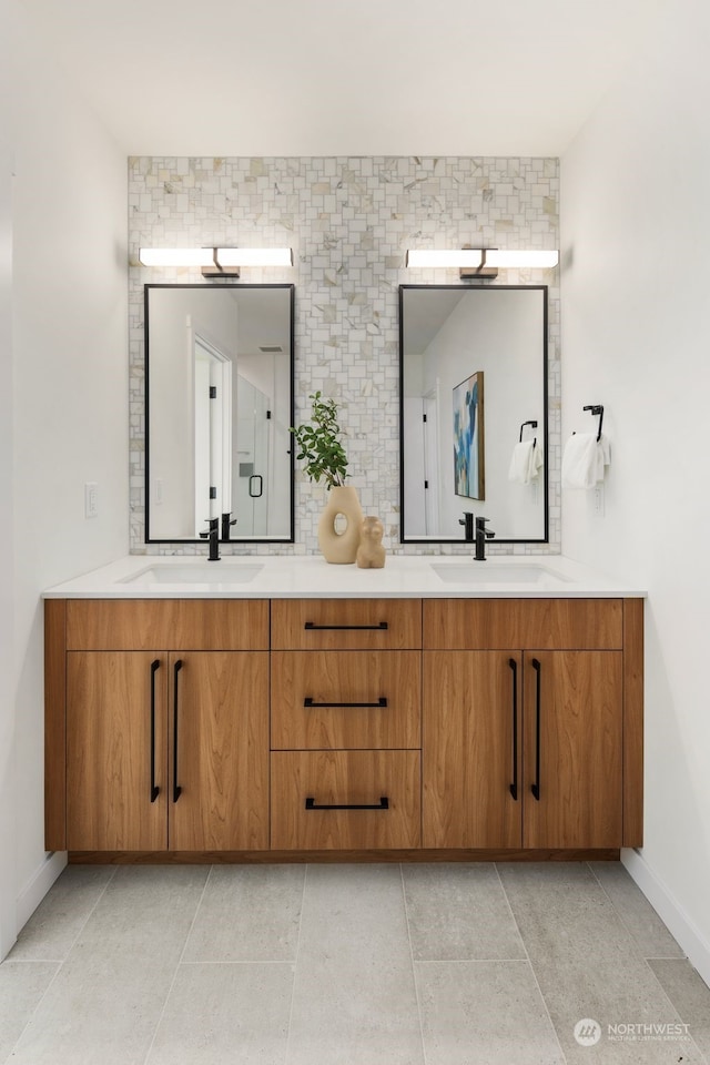 bathroom with vanity and decorative backsplash