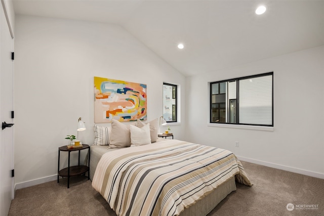 carpeted bedroom featuring lofted ceiling