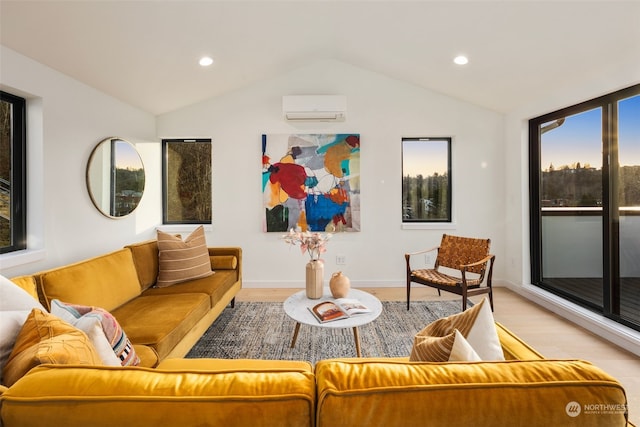 living room featuring lofted ceiling, a wall unit AC, and light wood-type flooring