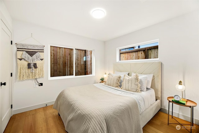 bedroom with wood-type flooring