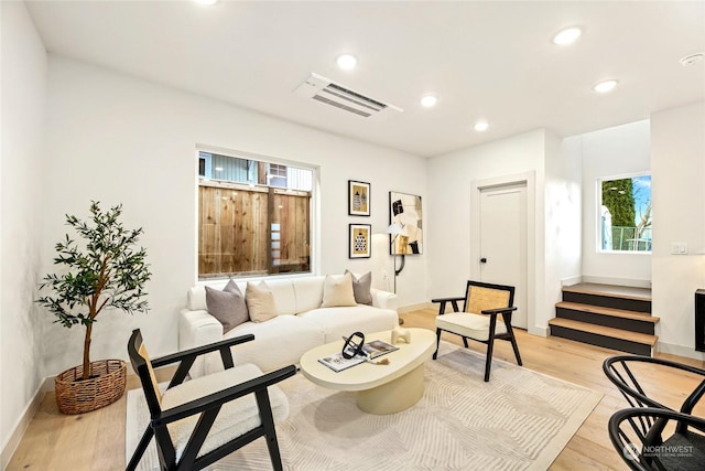 living room with light hardwood / wood-style flooring