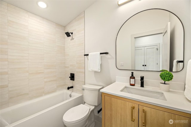 full bathroom featuring vanity, toilet, and tiled shower / bath