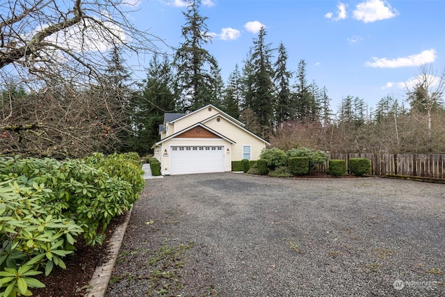 view of side of home featuring a garage